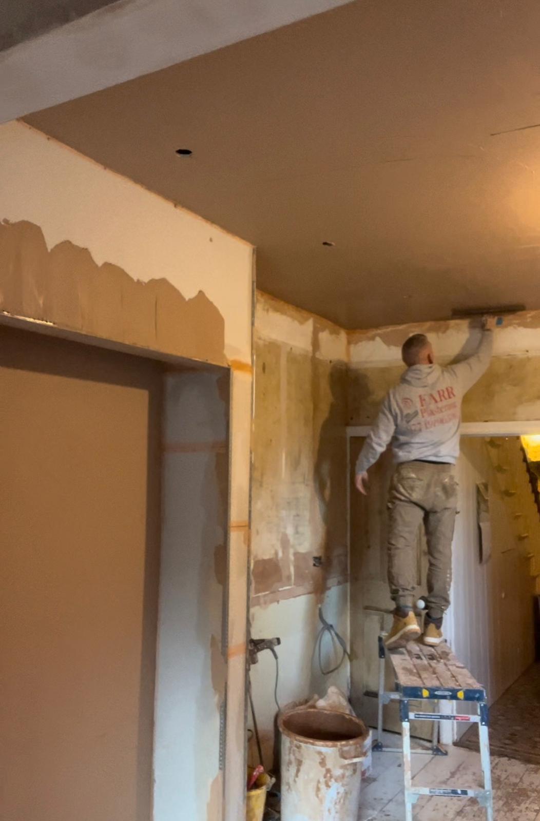 DFarr About Us image Dave Farr in action plastering